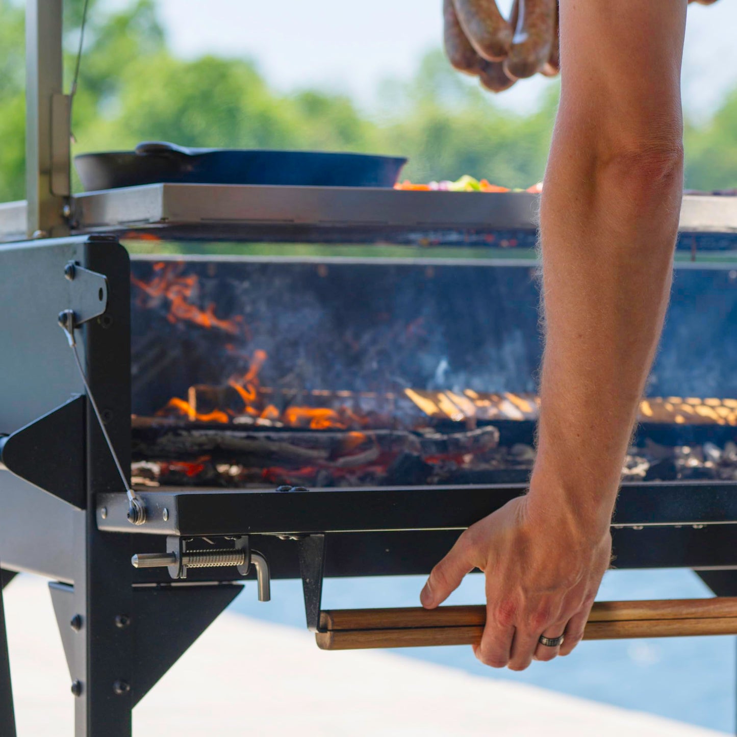Backyard Discovery Argentine Santa Maria Wood Fire & Charcoal BBQ Grill with Brasero, Adjustable Grill Grates, Fire Bricks, Heavy-Duty Steel, S-Hooks, Acacia Wood Table for Outdoor Gaucho Grilling